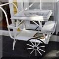 F27. White wicker tea cart. 